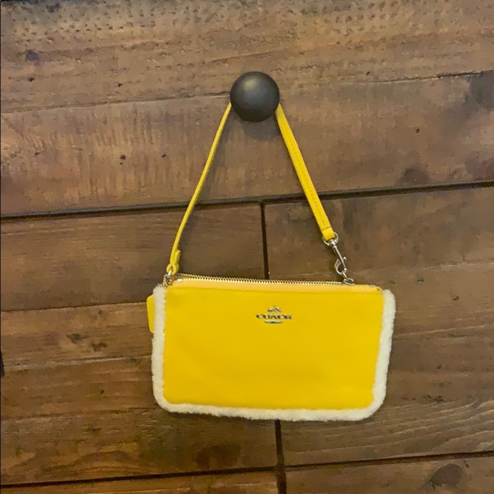 Coach wristlet- yellow with white fur boarder